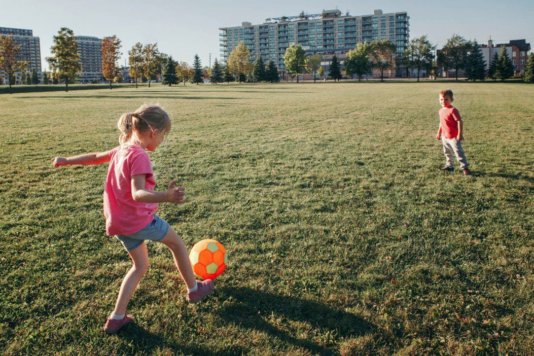 Children playing soccer.
