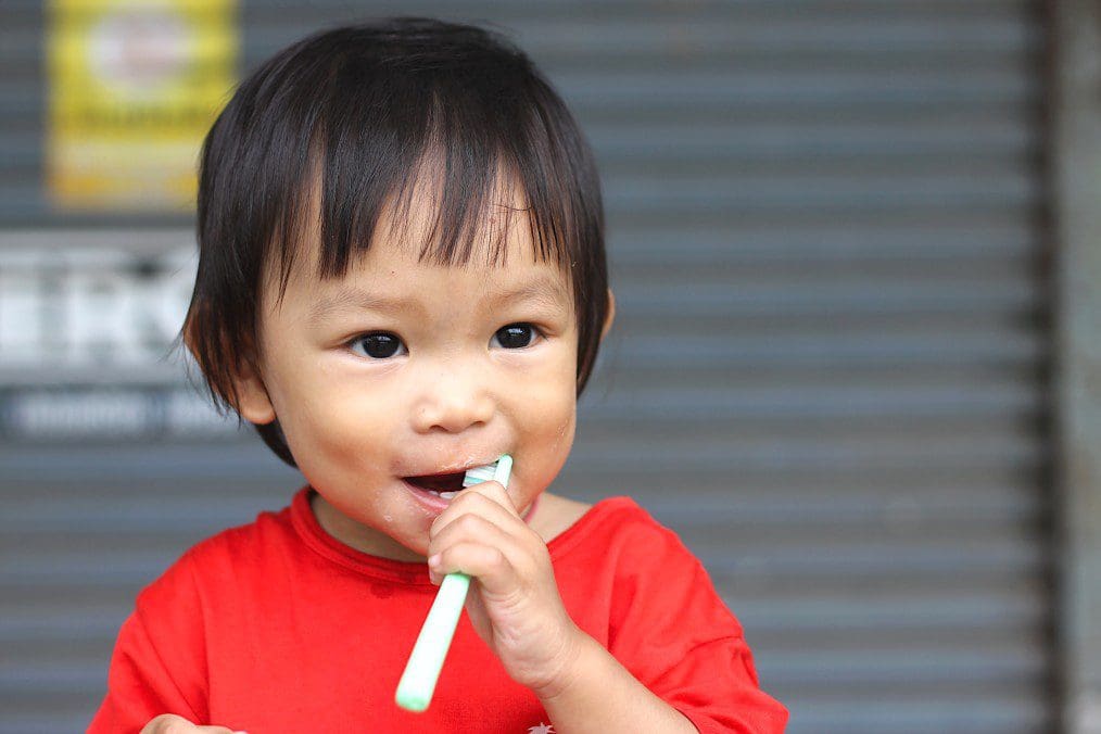 Child brushing teeth
