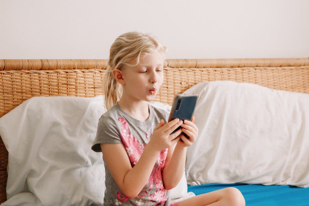 Child talking on the phone.