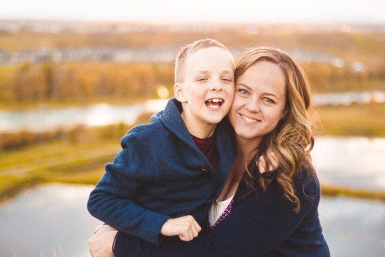 Mother hugging her child with autism.