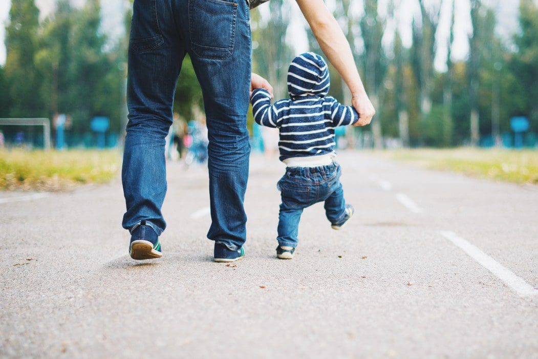 AaemrB_t20_4ljoBX Adult helping toddler walk