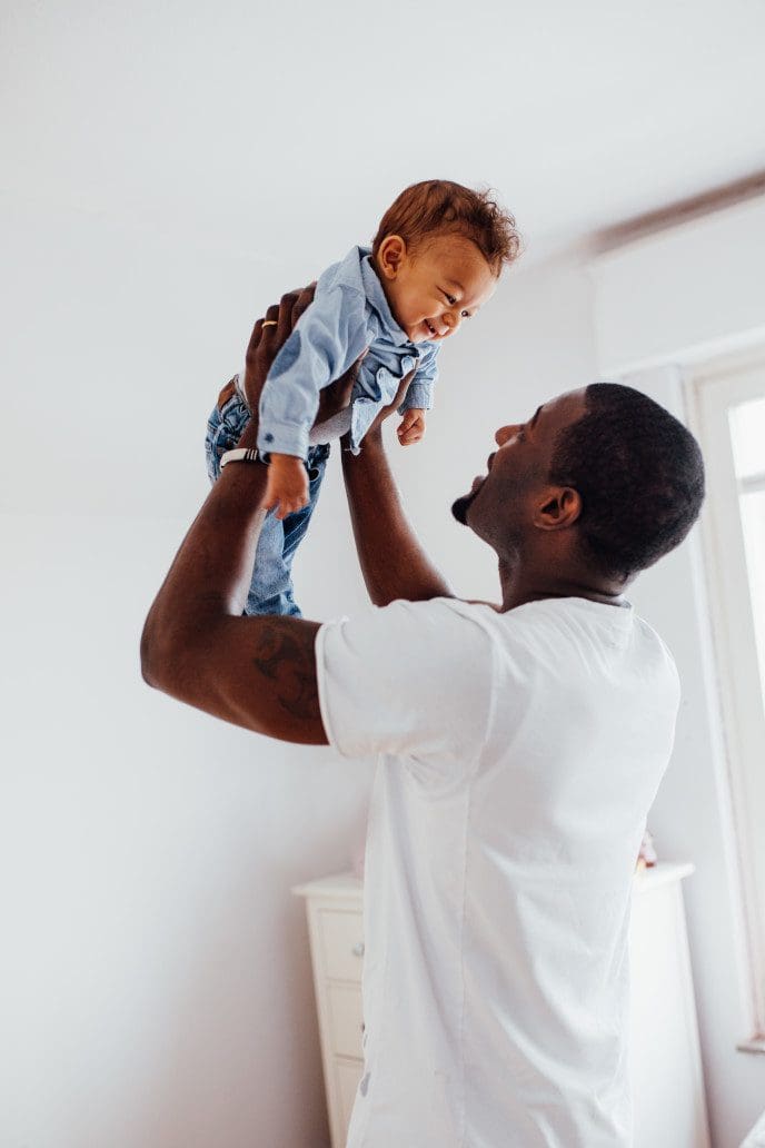 Dad and child playing