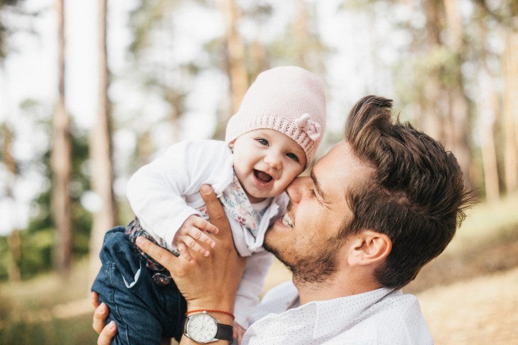 Dad and child smiling