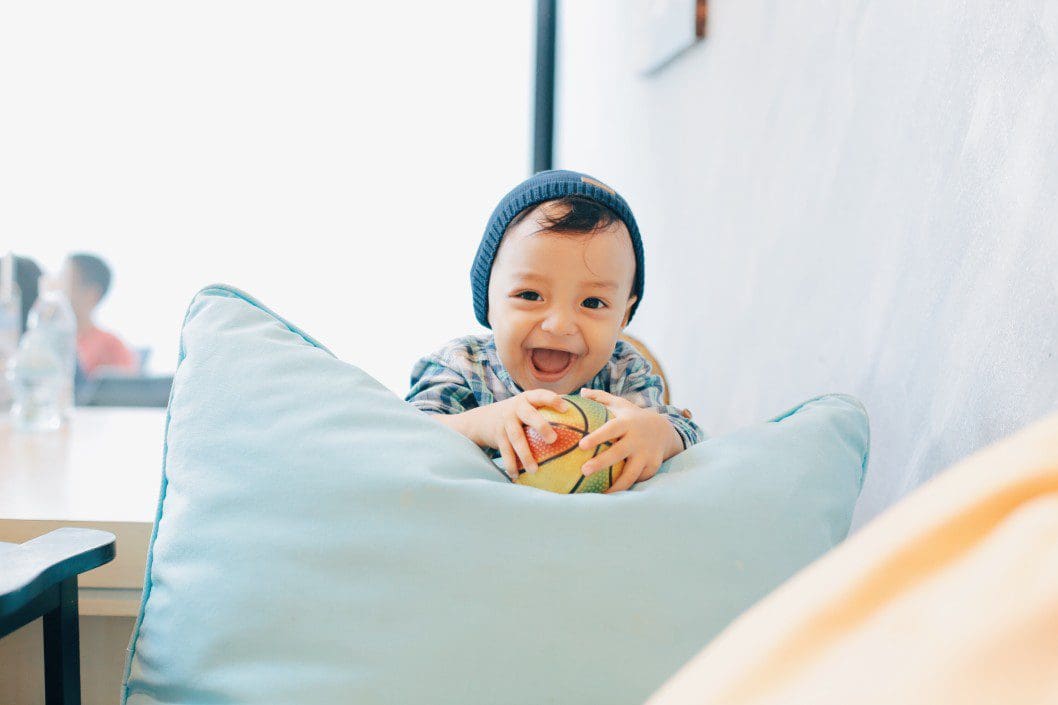 Child playing with a ball for sensory integration.