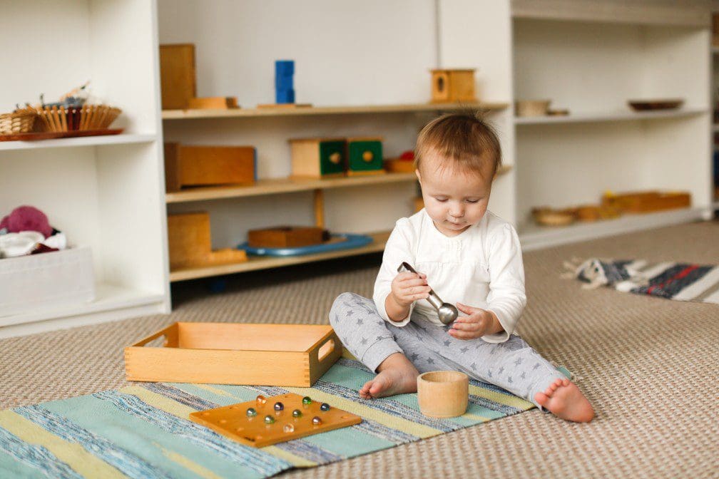 Child playing with sensory toys.